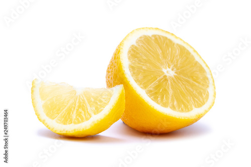 Isolated half and slice of juicy yellow lemon on white background