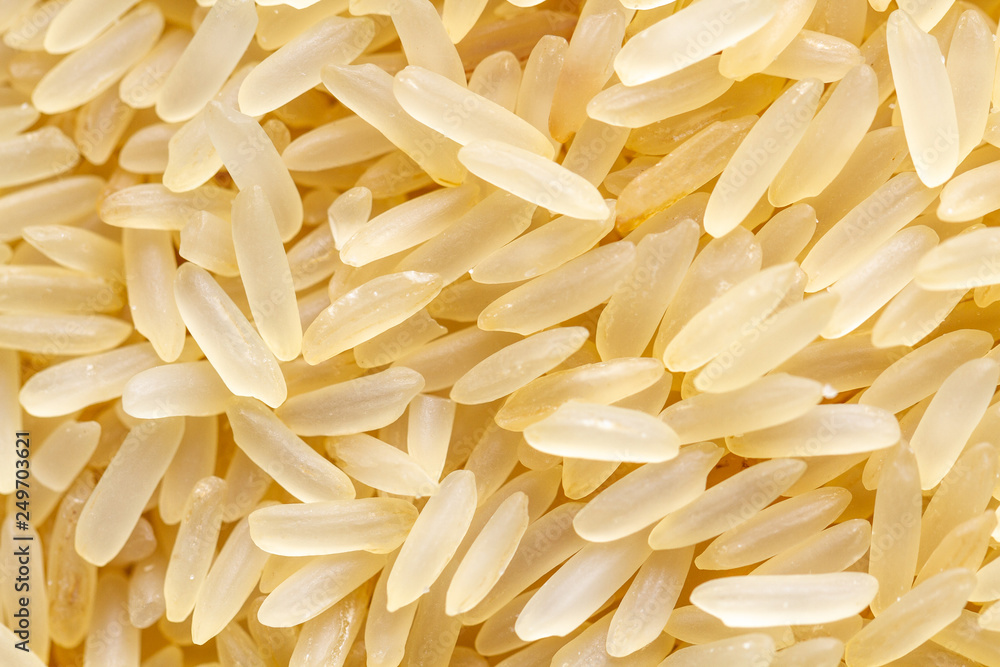 Texture of dry long golden yellow rice Texture of dry long golden yellow rice