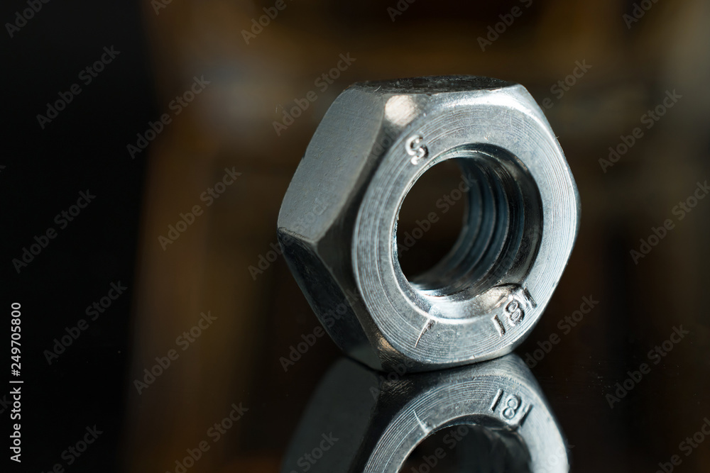 Composition with wrench and nut