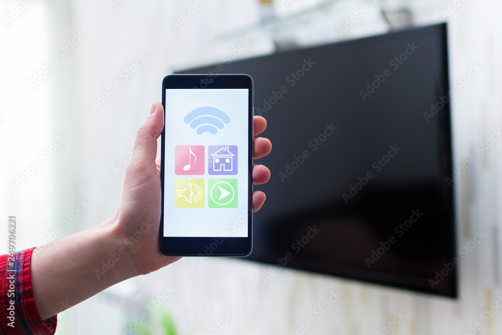 Online control smart TV by wifi using a mobile app on smartphone. Smart