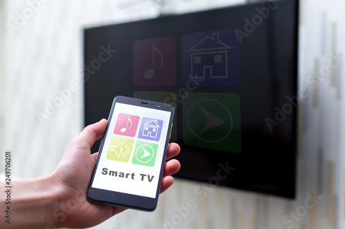 Online control TV by wifi using a mobile app on smartphone. Smart TV and home