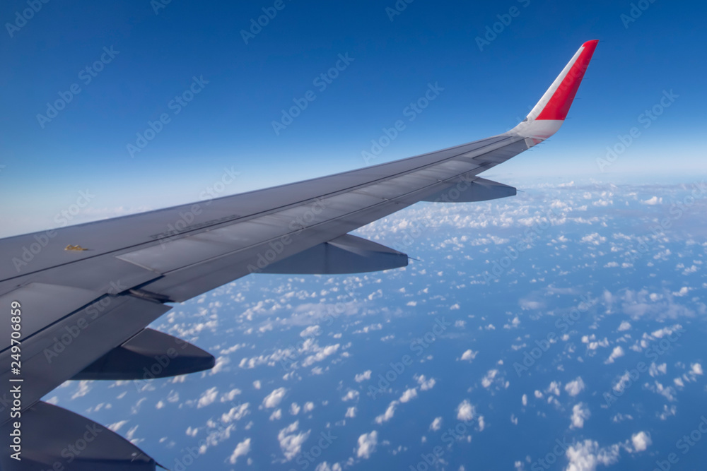 Aeroplane wing view from window beautiful sky. Traveling concept Aeroplane wing view from window beautiful sky. Traveling concept