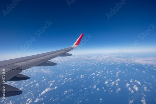 Aeroplane wing view from window beautiful sky. Traveling concept