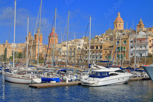 Coast of the city of Birgu in Malta with moored yachts.
