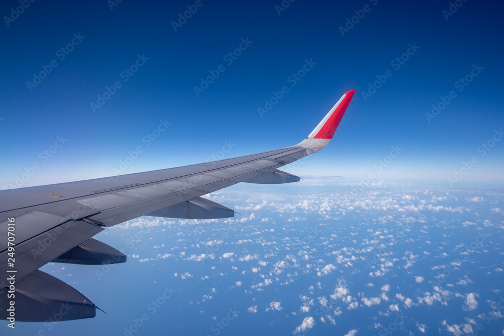 Aeroplane wing view from window beautiful sky. Traveling concept Aeroplane wing view from window beautiful sky. Traveling concept