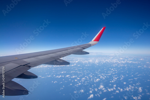 Aeroplane wing view from window beautiful sky. Traveling concept