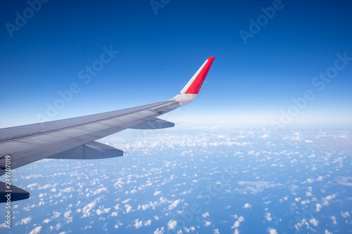 Aeroplane wing view from window beautiful sky. Traveling concept