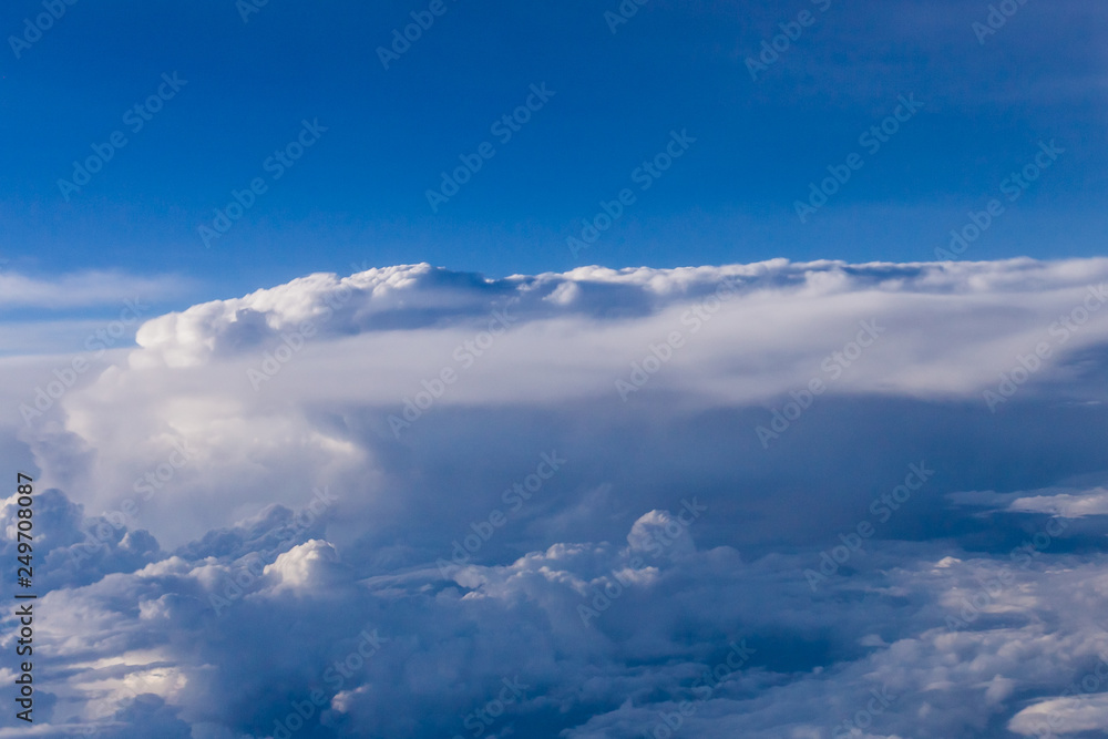 White clouds and blue sky from an airplane