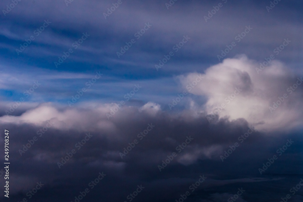 White clouds and blue sky from an airplane