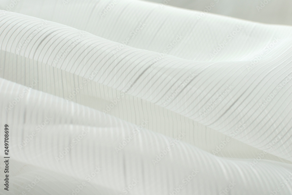 white cloth closeup. Smooth soft curves of the fabric. Can be used as background. white cloth closeup. Smooth soft curves of the fabric. Can be used as background.