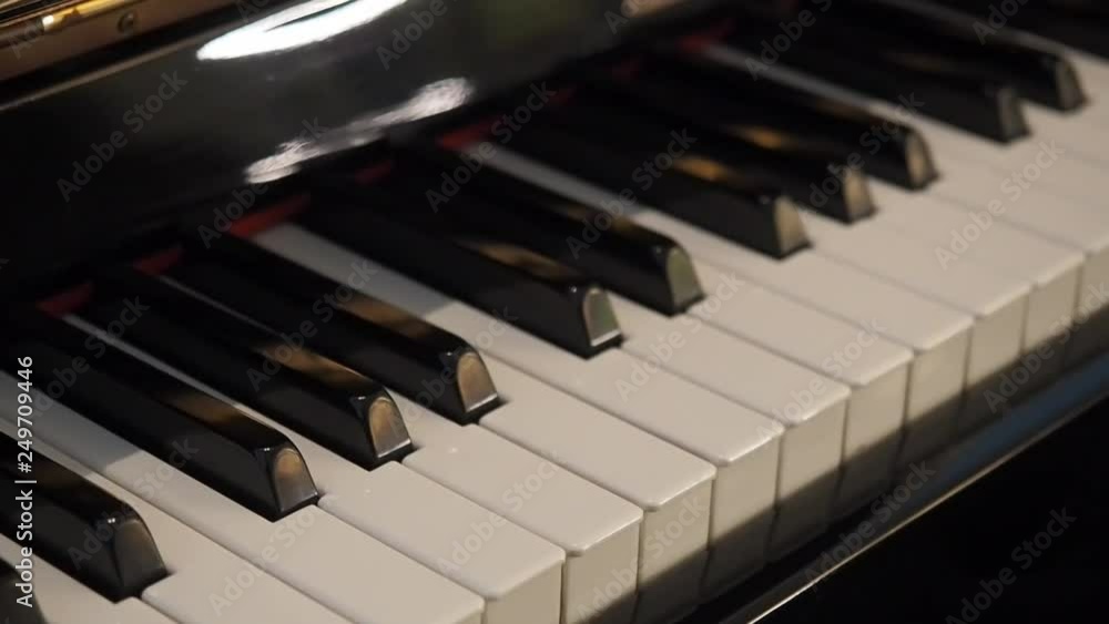 Close-up video showing piano keys. motion shooting. Close-up video showing piano keys. motion shooting.