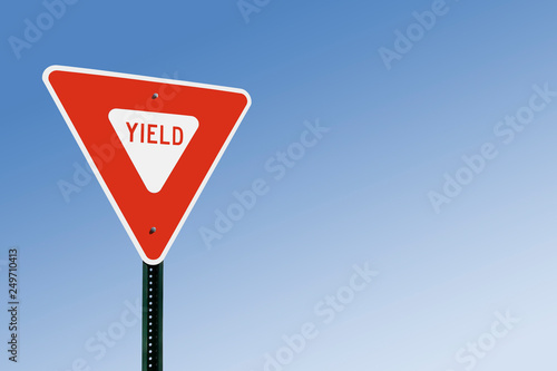 Yield Sign Against Blue Sky