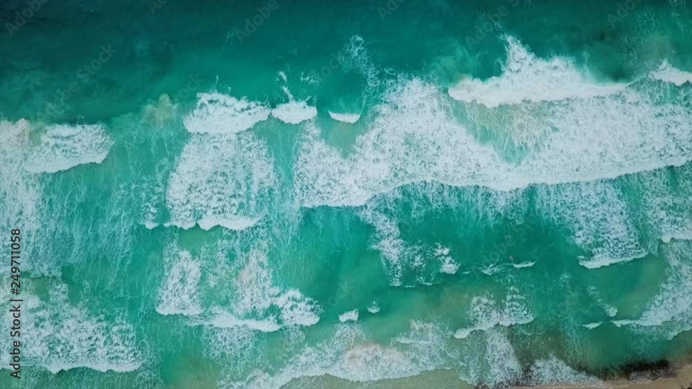 Aerial Tilt Down: Huge Wave Approaching Shorelines of Carmen Del Playa Beach