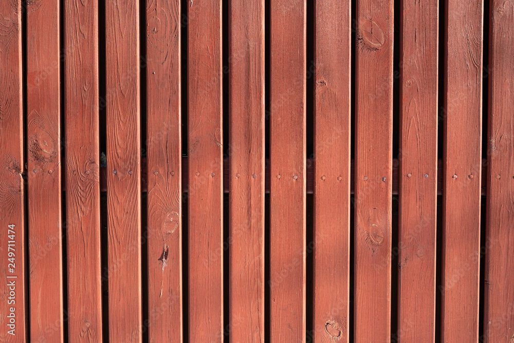 Obraz premium Texture of a red wooden fence