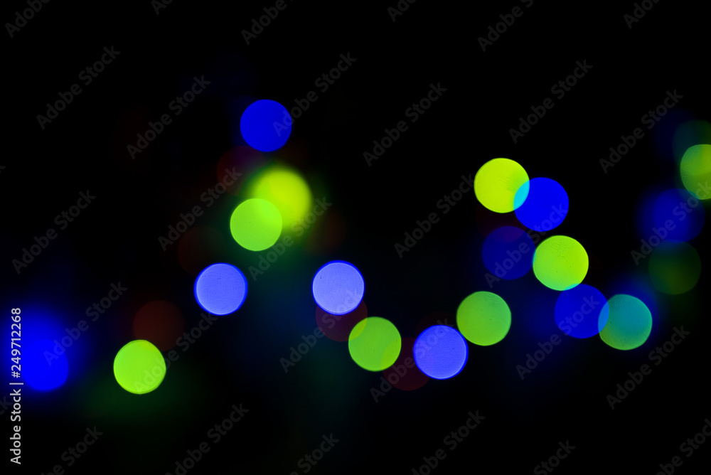 Bokeh. Holiday background. Garland. Christmas lights. Defocused sparkles Bokeh. Holiday background. Garland. Christmas lights. Defocused sparkles
