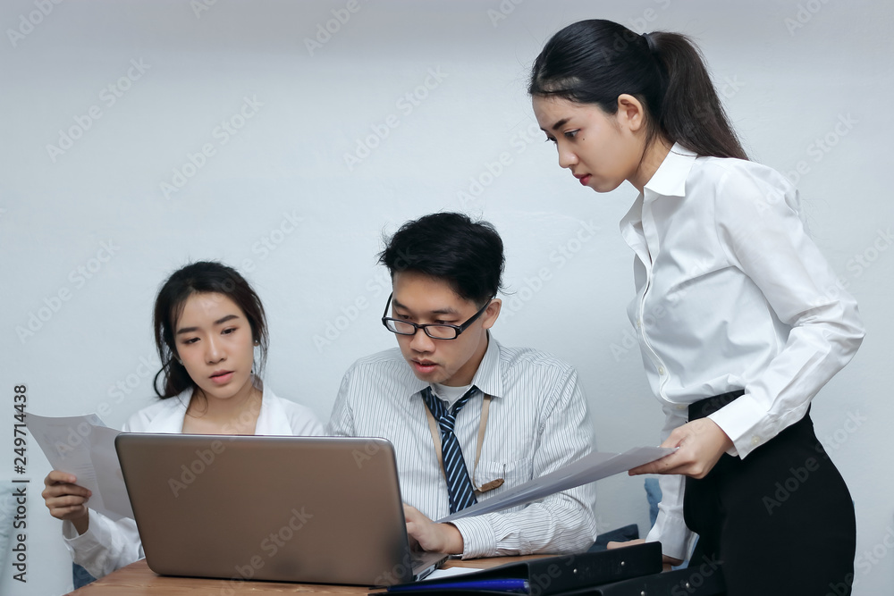 Brainstorm business concept. Confident young Asian employee working together on workplace in office. Brainstorm business concept. Confident young Asian employee working together on workplace in office.
