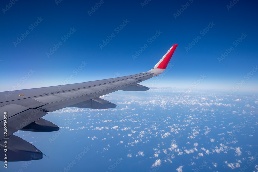 Aeroplane wing view from window beautiful sky. Traveling concept Aeroplane wing view from window beautiful sky. Traveling concept