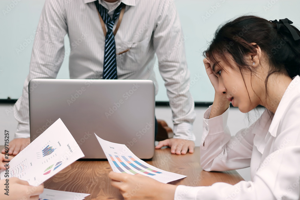frustrated stressed Asian business female suffering from severe depression during meeting. frustrated stressed Asian business female suffering from severe depression during meeting.