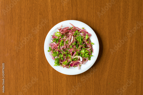 Konstfotografi Traditional Turkish onion Kebab Salad in plate on wooden table