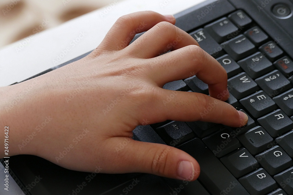 fingers touching a computer keyboard, fingers touching a computer keyboard,