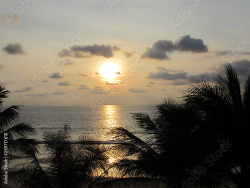 Beautiful sunset at a beach resort in tropics.