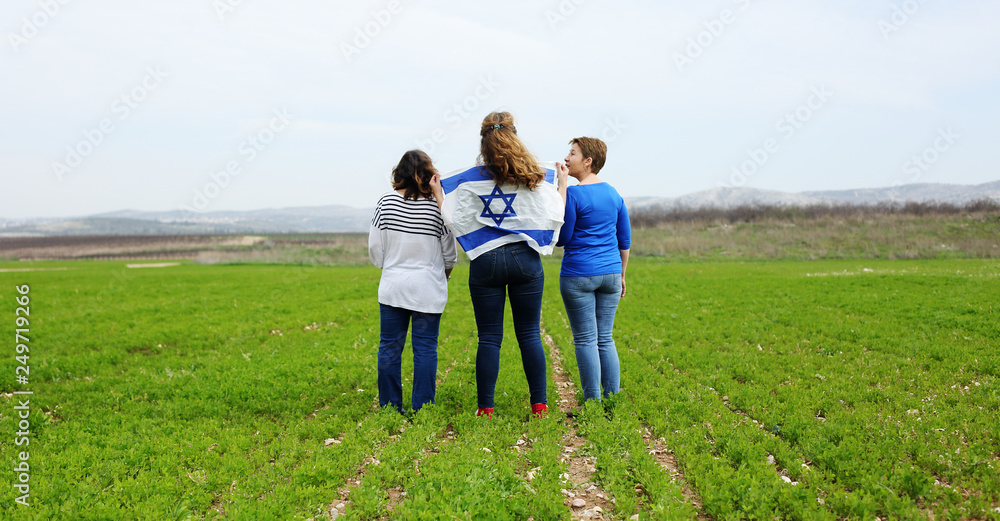 Women holding an Israeli flag