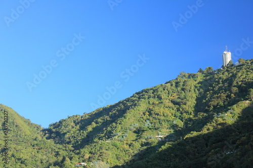 Fototapeta Naklejka Na Ścianę i Meble -  A view of El Avila National Park, famous mountain in Caracas, Venezuela and iconic Humboldt Hotel designed by architec Tomas Jose Sanabria 