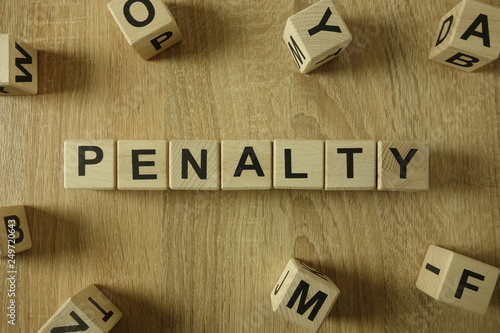 Penalty word from wooden blocks on desk