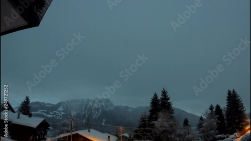 Fast changing weather time lapse in Swiss mountain village photo