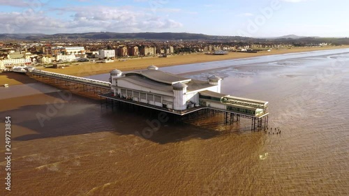 Aerial sequence depicting the Grand Pier, Weston-super-Mare, Somerset. Built in the late 1890's. Well maintained and modernised, a popular tourist pleasure attraction and setting for many TV shows