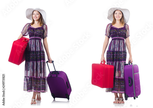 Young woman with suitcases isolated on white