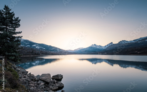 Sunset over snowy mountains and Lake Calacuccia in Corsica © Jon Ingall