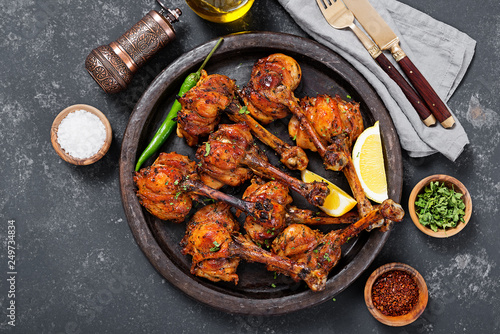 Grilled chicken legs with spices. Turkish Pirzola Kebab . photo