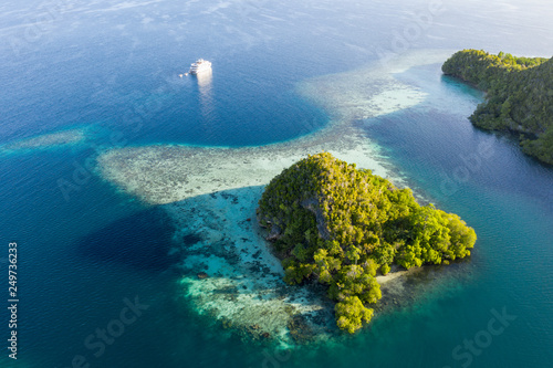Early Light, Limestone Islands, and Ship in Raja Ampat © ead72