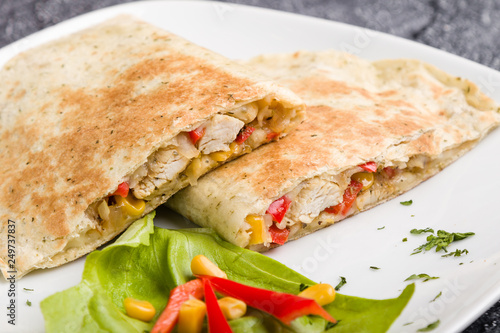 tasty fresh quesadilla with chicken meat and vegetables