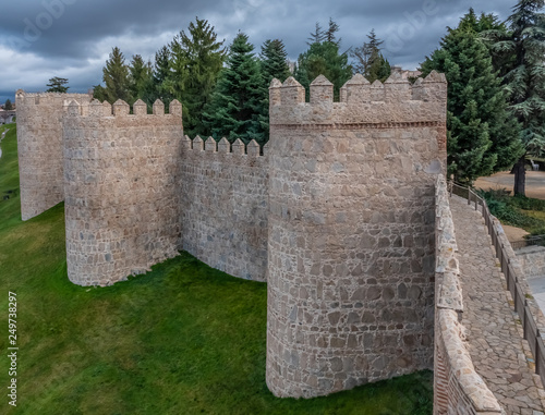 The magnificent medieval walls of Avila, Castile-Leon, Spain. A UNESCO World Heritage Site completed between the 11th and 14th centuries photo