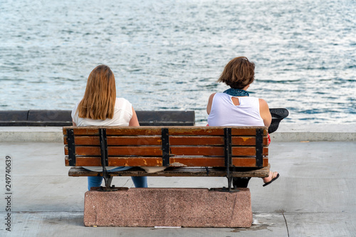 two woman escape busy life photo