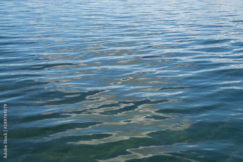 Background from the blue expanse of lake with small waves. Background from the blue expanse of lake with small waves.