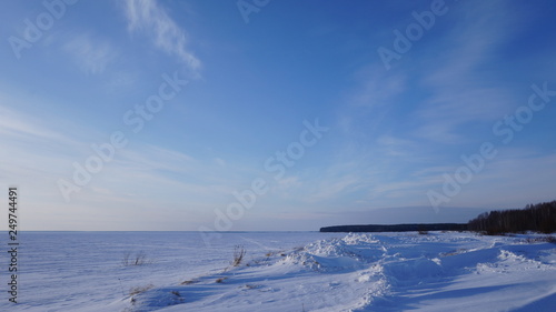 winter landscape with blue sky and clouds © Константин Горбовски