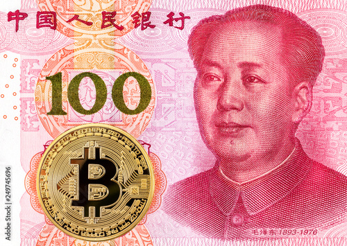 Bitcoin lying on the Chinese 100 yuan banknote