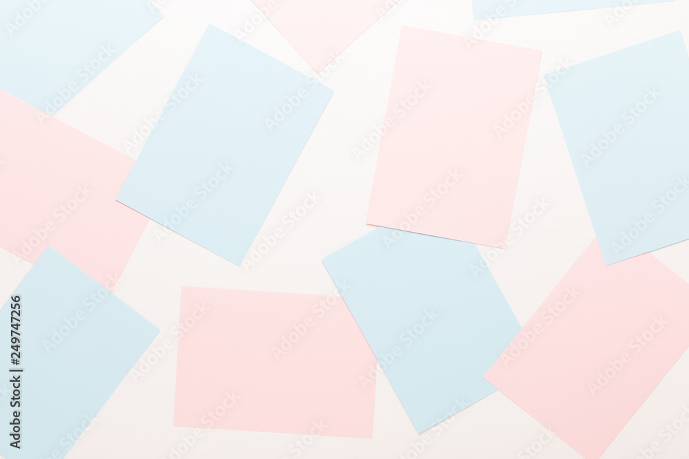 Abstract geometric background in light pastel tones from sheets of thick pale past paper. Abstract geometric background in light pastel tones from sheets of thick pale past paper.