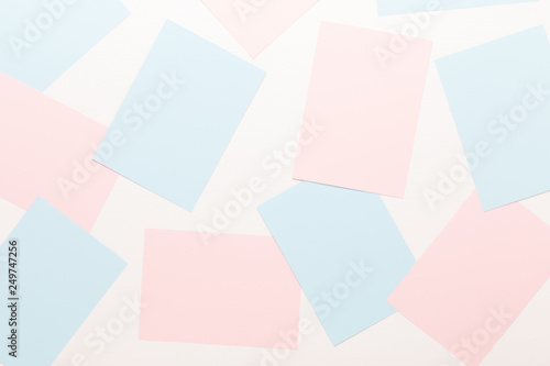Abstract geometric background in light pastel tones from sheets of thick pale past paper.