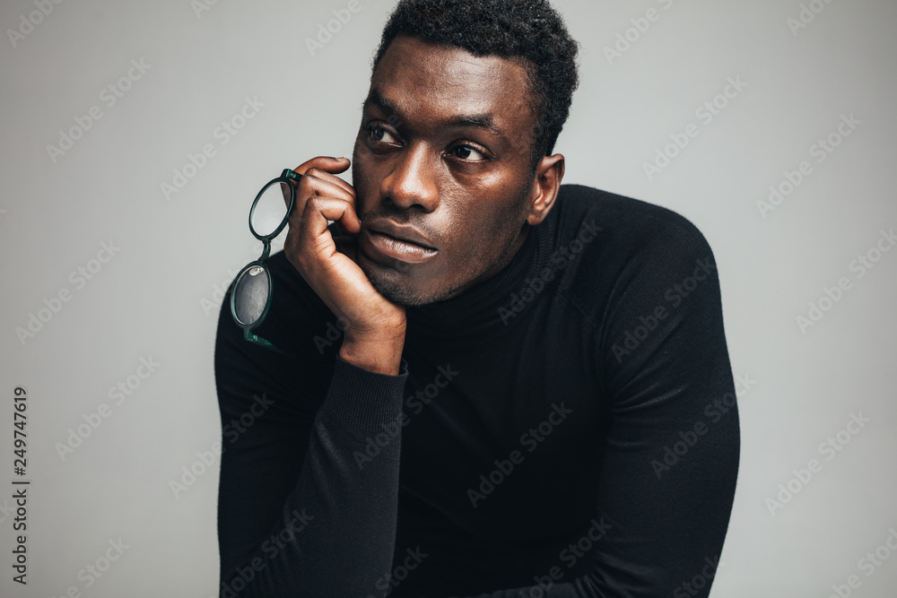 Fototapeta premium Thoughtful young african guy