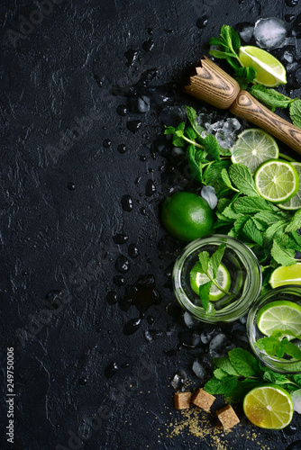 Homemade citrus lemonade mojito with ingredients for making.Top view with copy space.