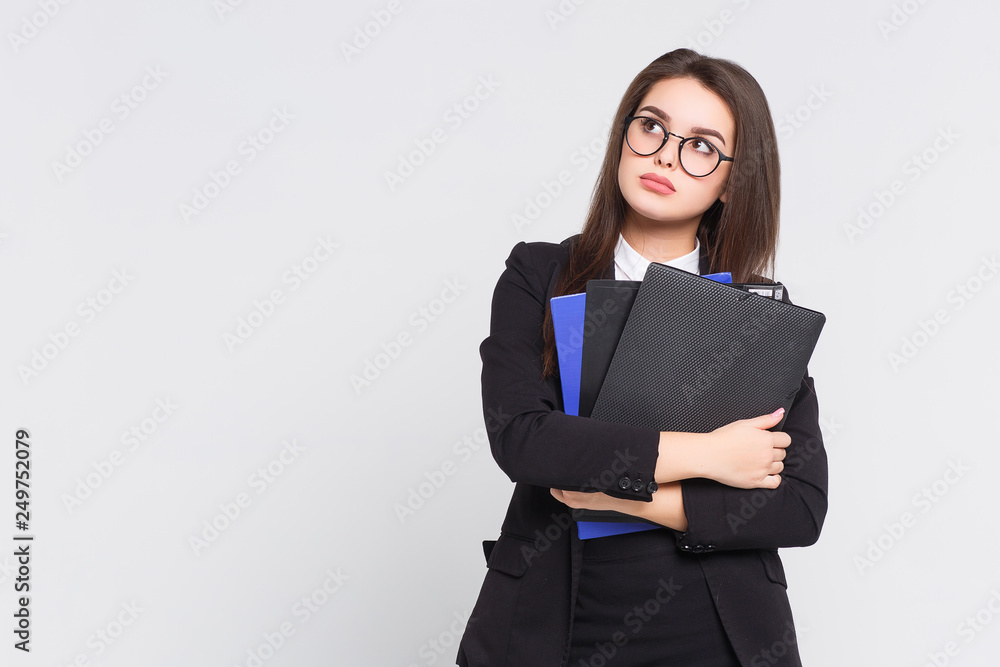 Gorgeous brunette woman wearing at black suit on white background! Business concept. Holding 3 folders. Gorgeous brunette woman wearing at black suit on white background! Business concept. Holding 3 folders.