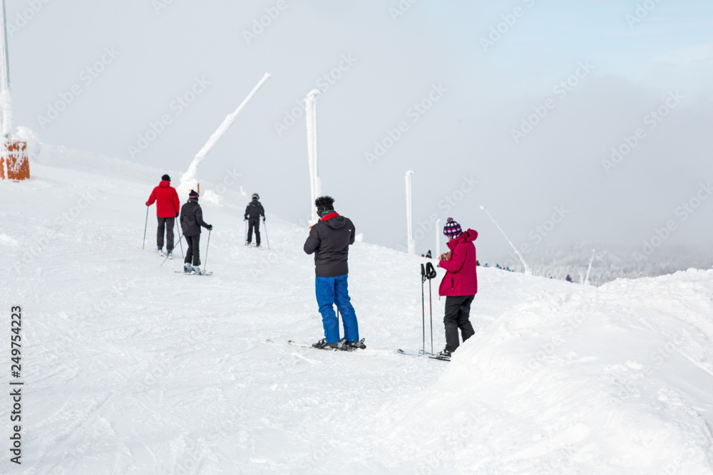 Skiers on mountain in snow season