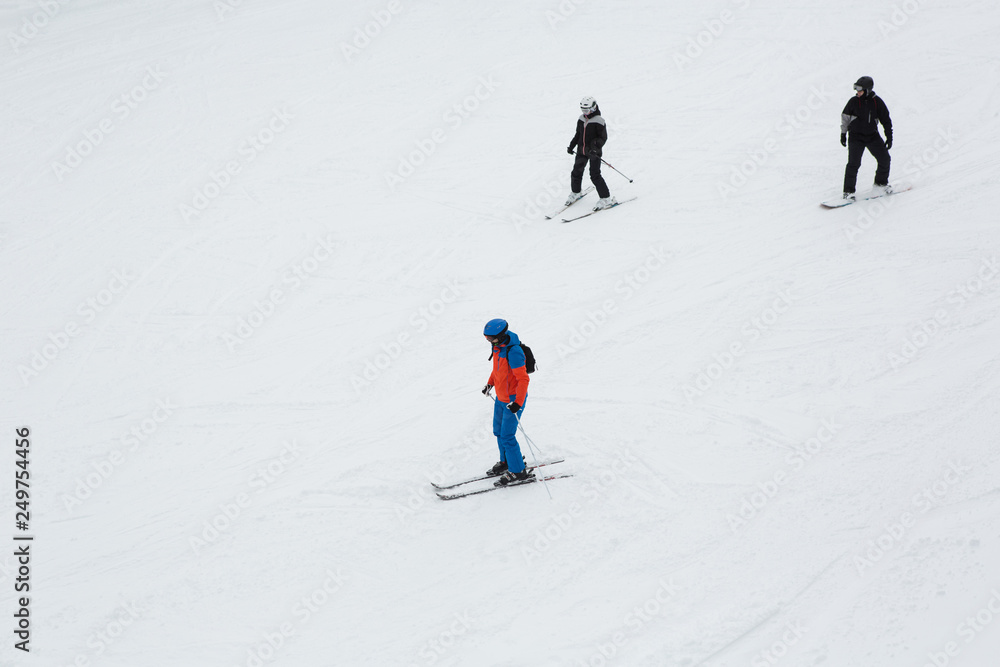 Skiers on mountain in snow season