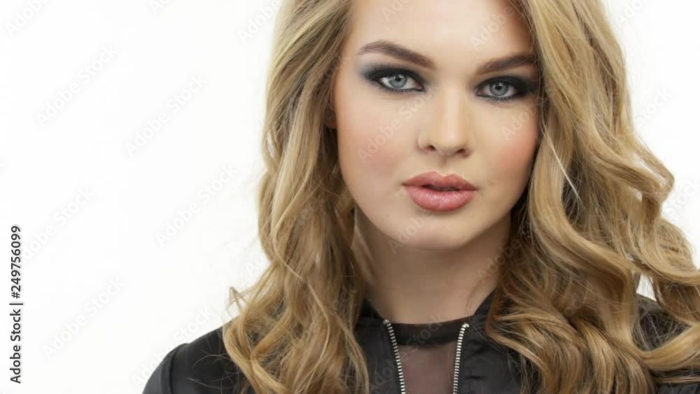 Beautiful woman with a long blond hair. Fashion model with a stylish makeup. Beautiful woman with a long blond hair. Fashion model with a stylish makeup.