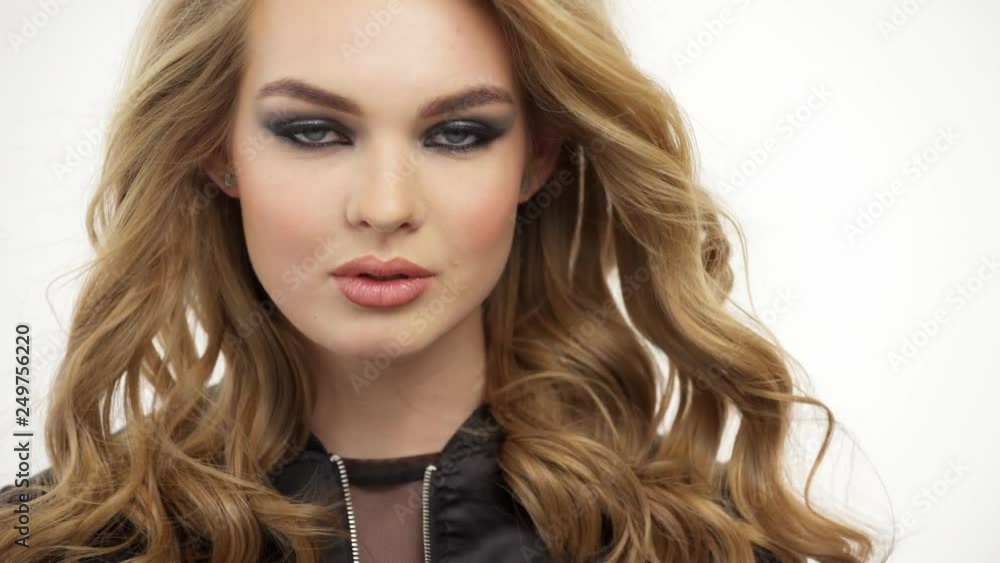Beautiful woman with a long blond hair. Fashion model with a stylish makeup. Beautiful woman with a long blond hair. Fashion model with a stylish makeup.