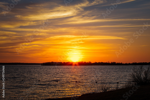 Fototapeta Naklejka Na Ścianę i Meble -  Sunset over a lake in Oklahoma.